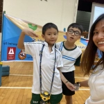 Students posing for a photograph at ONE's rock climbing event